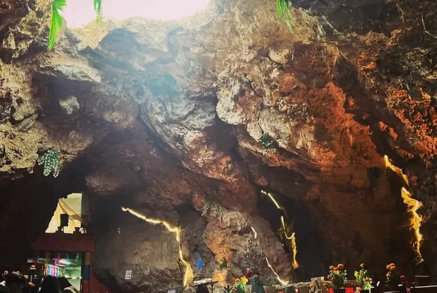 Natural light pours through the volcanic rock skylight and lights up the dining room of La Cueva restaurant in Teotihuacan